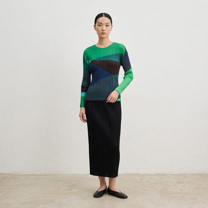 Pleats Please Issey Miyake ORBIT long sleeve pleated top with abstract geometric colour-blocking in green, teal, navy and black - lifestyle