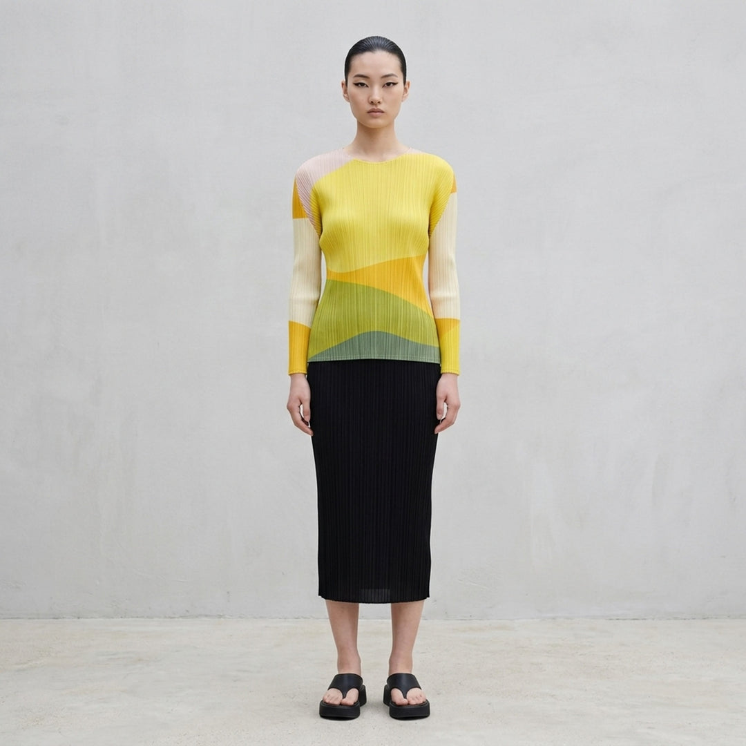 Pleats Please Issey Miyake ORBIT long sleeve pleated top with abstract geometric colour-blocking in green, teal, navy and black - lifestyle
