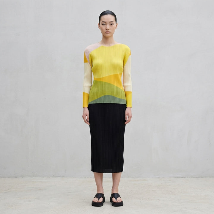 Pleats Please Issey Miyake ORBIT long sleeve pleated top with abstract geometric colour-blocking in green, teal, navy and black - lifestyle