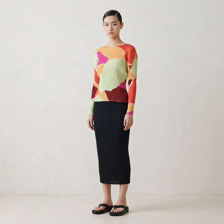 Pleats Please Issey Miyake SURPRISE! long sleeve micro-pleated top featuring a large-scale abstract print in lavender, cobalt blue, teal, taupe, and black with a contrast round neckline - lifestyle