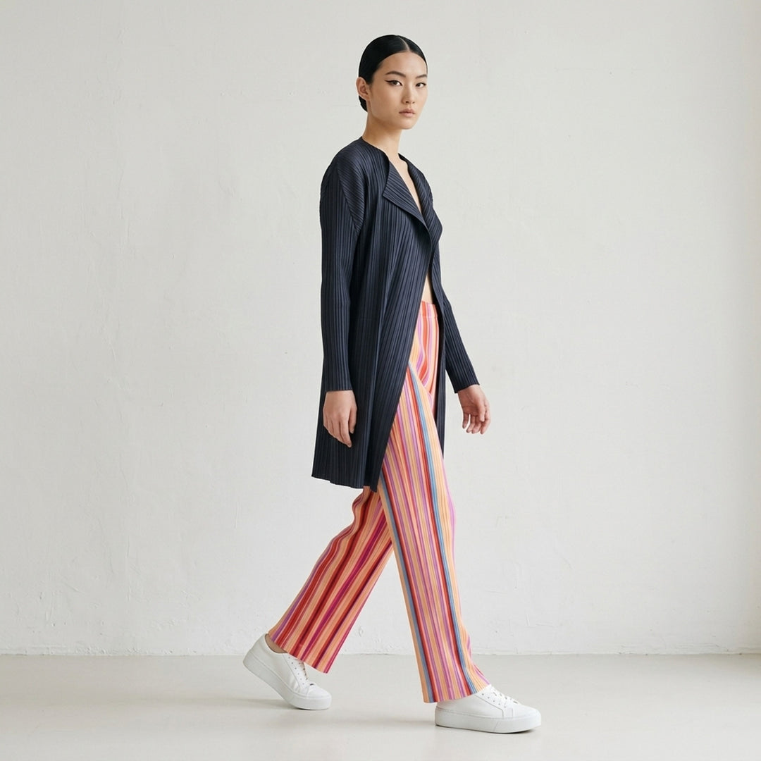 Pleats Please Issey Miyake TAPE TAPE Pants featuring multicolour vertical stripes in tangerine, fuchsia, violet, coral, and sky blue with a cropped flared silhouette and elasticated waistband - lifestyle
