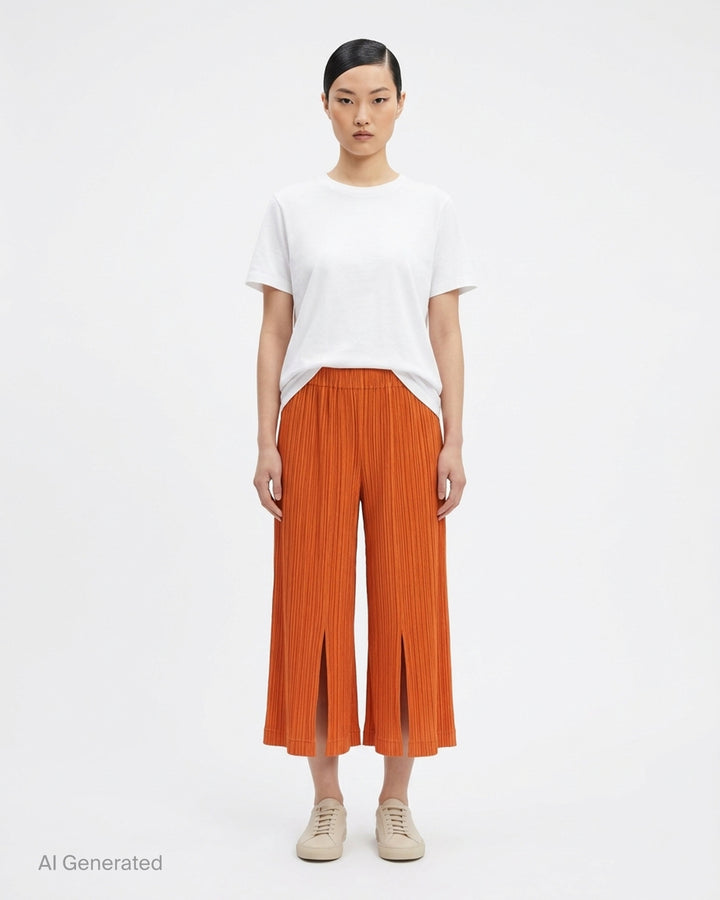 Pleats Please Issey Miyake Thicker Bottoms 2 wide-leg pleated culottes in charcoal with elasticated waistband and accordion micro-pleat construction - front
