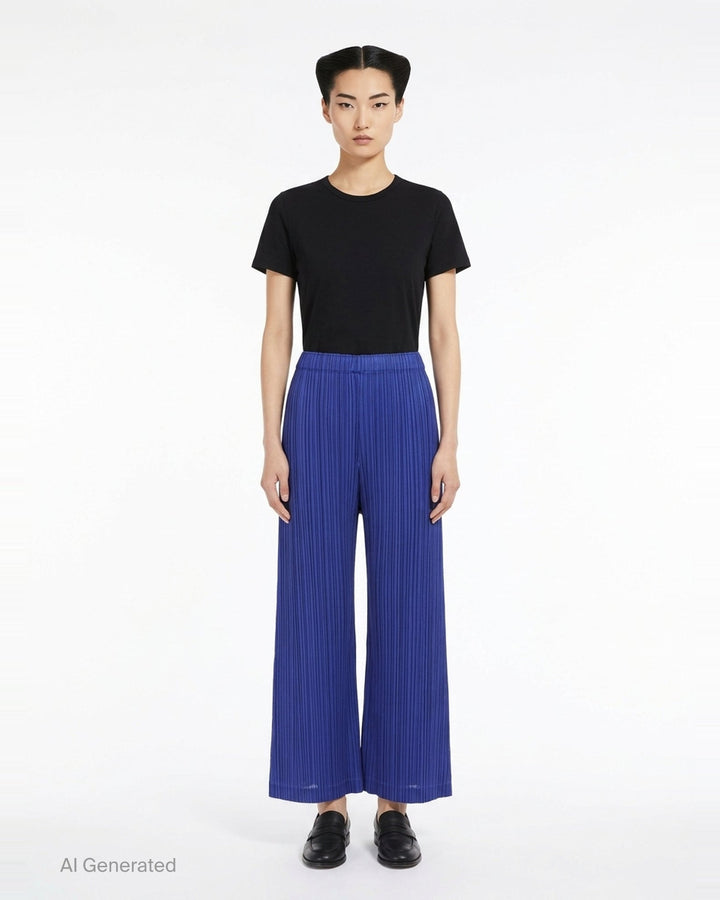 Pleats Please Issey Miyake Thicker Bottoms wide-leg pants in royal blue with all-over micro-pleating and elasticated waistband, shown from the back - front