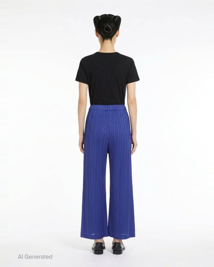 Pleats Please Issey Miyake Thicker Bottoms wide-leg pants in royal blue with all-over micro-pleating and elasticated waistband, shown from the back - back