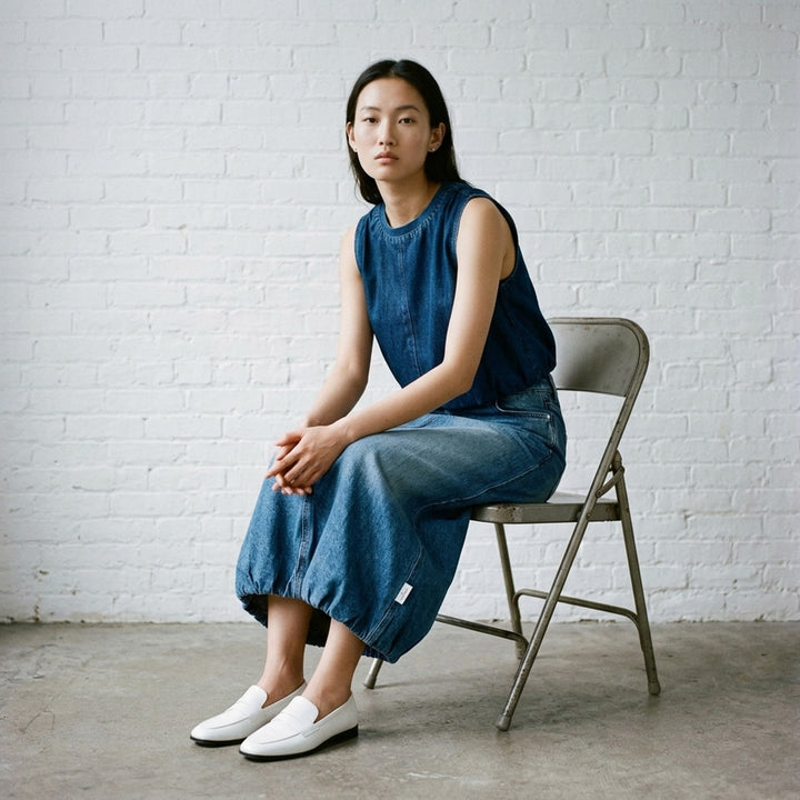 rag & bone Miramar Terry Bubble Skirt in light wash blue denim, featuring a front centre seam, bubble hem, and five-pocket construction - lifestyle