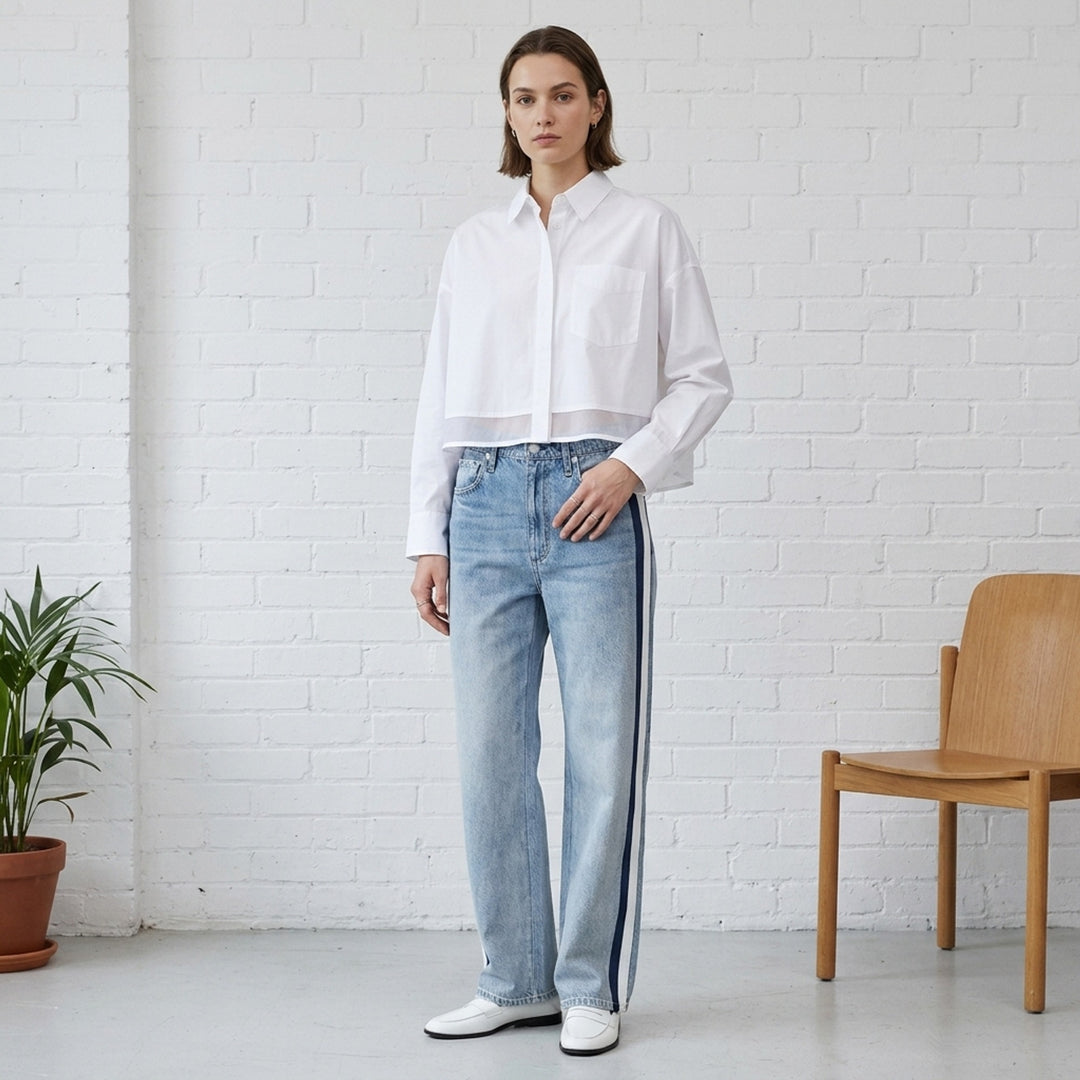rag & bone washed black wide-leg jeans with contrast green and white side stripes along the outer seams, high-rise fit, five-pocket construction - lifestyle