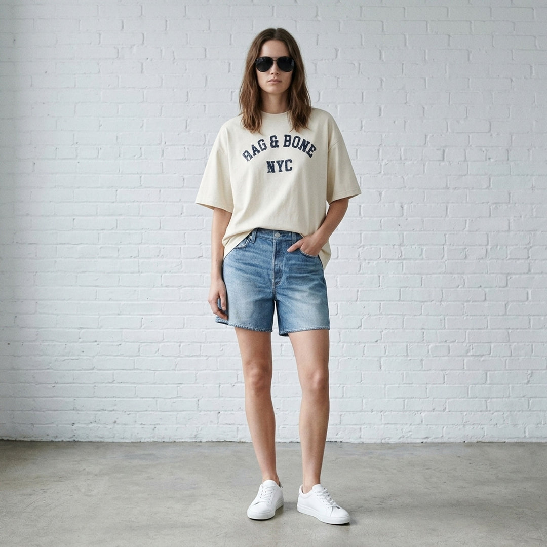 rag & bone University Alex Tee in washed navy, featuring a distressed arched collegiate graphic print reading 'RAG & BONE NYC', relaxed oversized fit with a crewneck collar and short sleeves - lifestyle