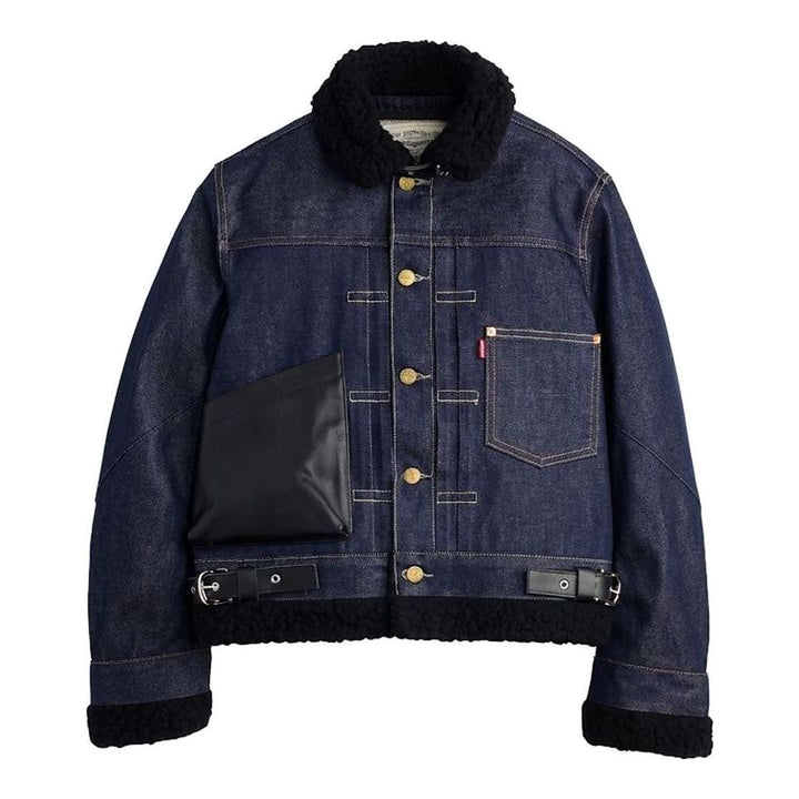sacai x Levi's women's indigo denim trucker jacket with cream sherpa collar, cuffs and hem, leather patch pocket and buckled side straps - packshot