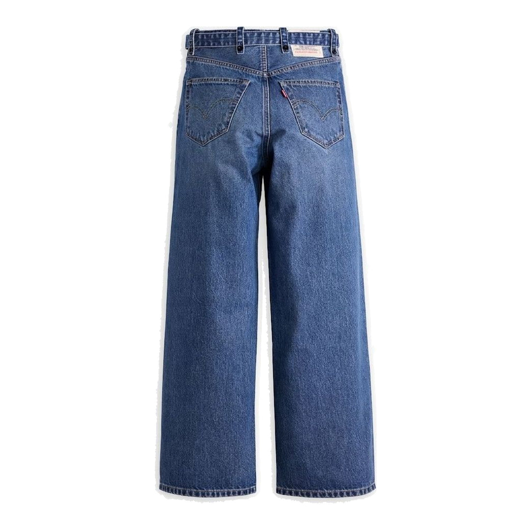 sacai x Levi's wide-leg mid-wash blue jeans with layered waistband and integrated webbing belt, shown flat from the front - packshot