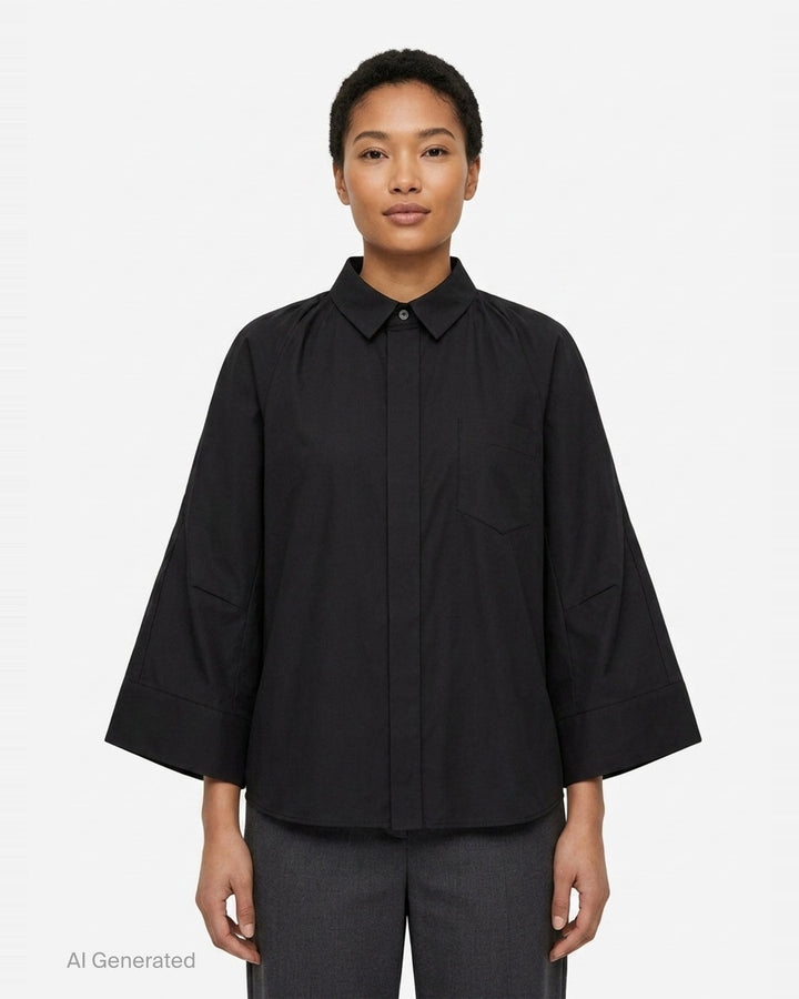 sacai Wide Sleeve Poplin Shirt in black, featuring a concealed button placket, point collar, flared long sleeves with deep cuffs, a chest patch pocket, and twin lower patch pockets - front