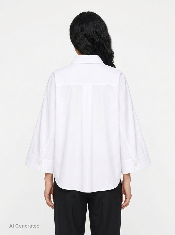 sacai Wide Sleeve Poplin Shirt in black, featuring a concealed button placket, point collar, flared long sleeves with deep cuffs, a chest patch pocket, and twin lower patch pockets - back