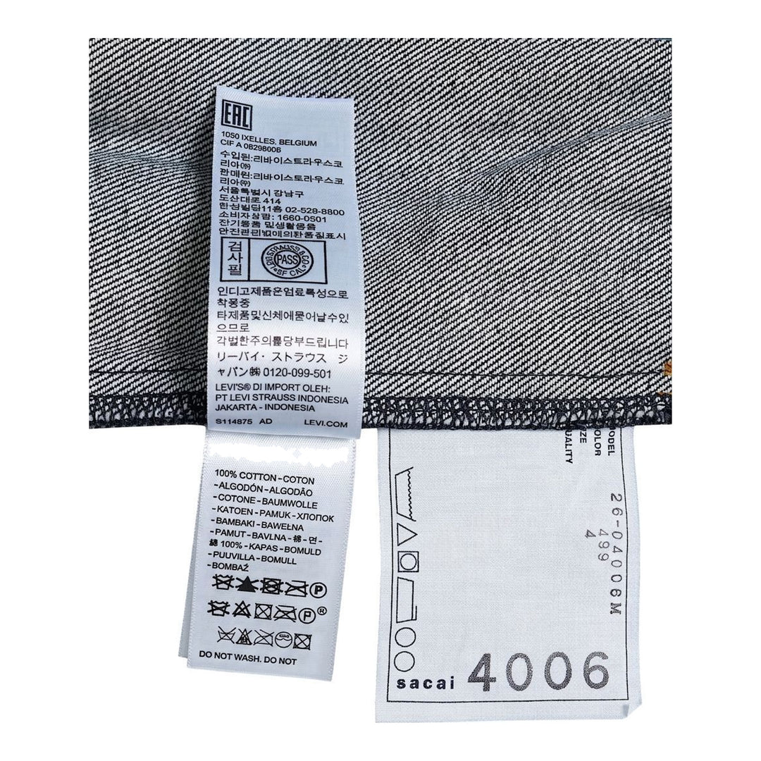 sacai x Levi's denim blouson jacket in stonewashed indigo with white zip front, flap chest pockets and sleeve zip pocket - packshot