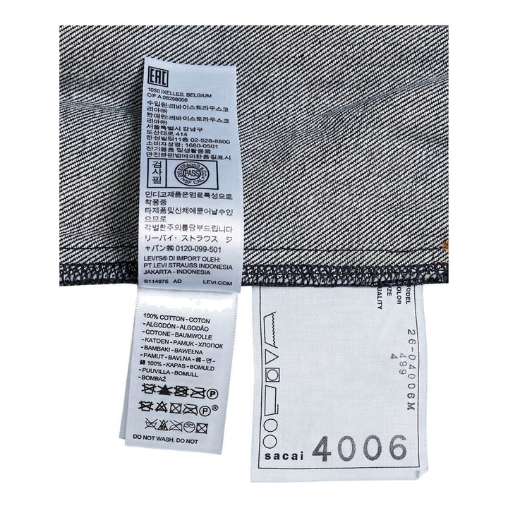 sacai x Levi's denim blouson jacket in stonewashed indigo with white zip front, flap chest pockets and sleeve zip pocket - packshot