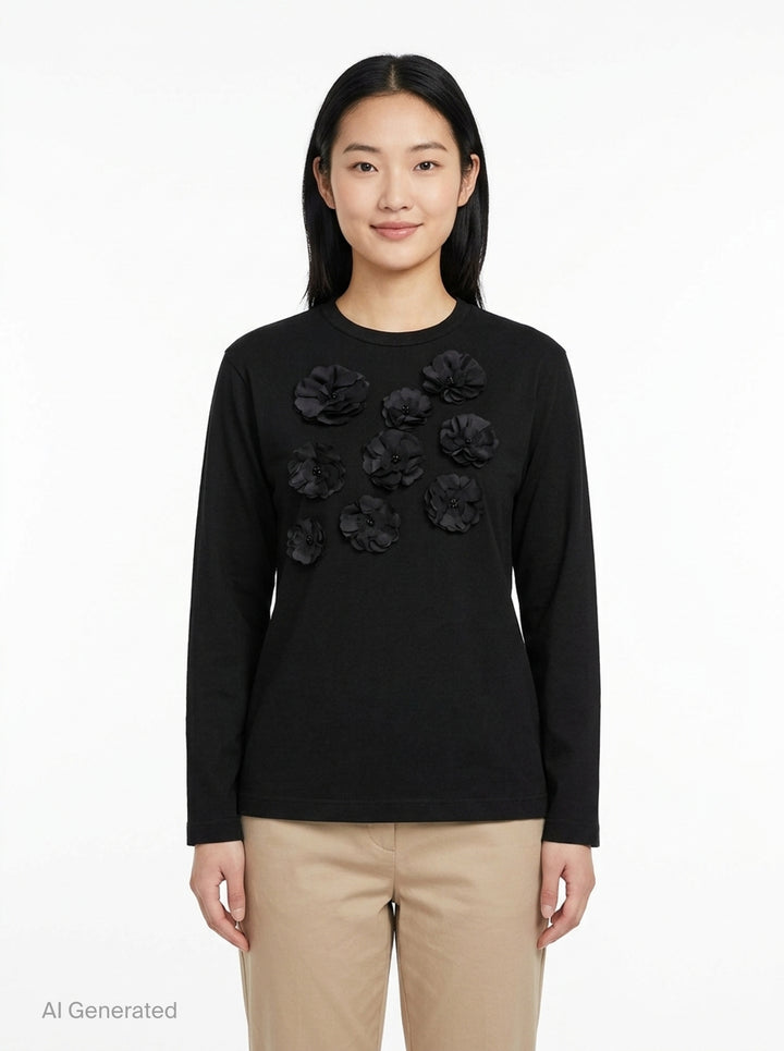 Tao black long sleeve crew neck top with nine tonal satin 3D floral appliqués and bead centres scattered across the chest, shot flat on a white background - front