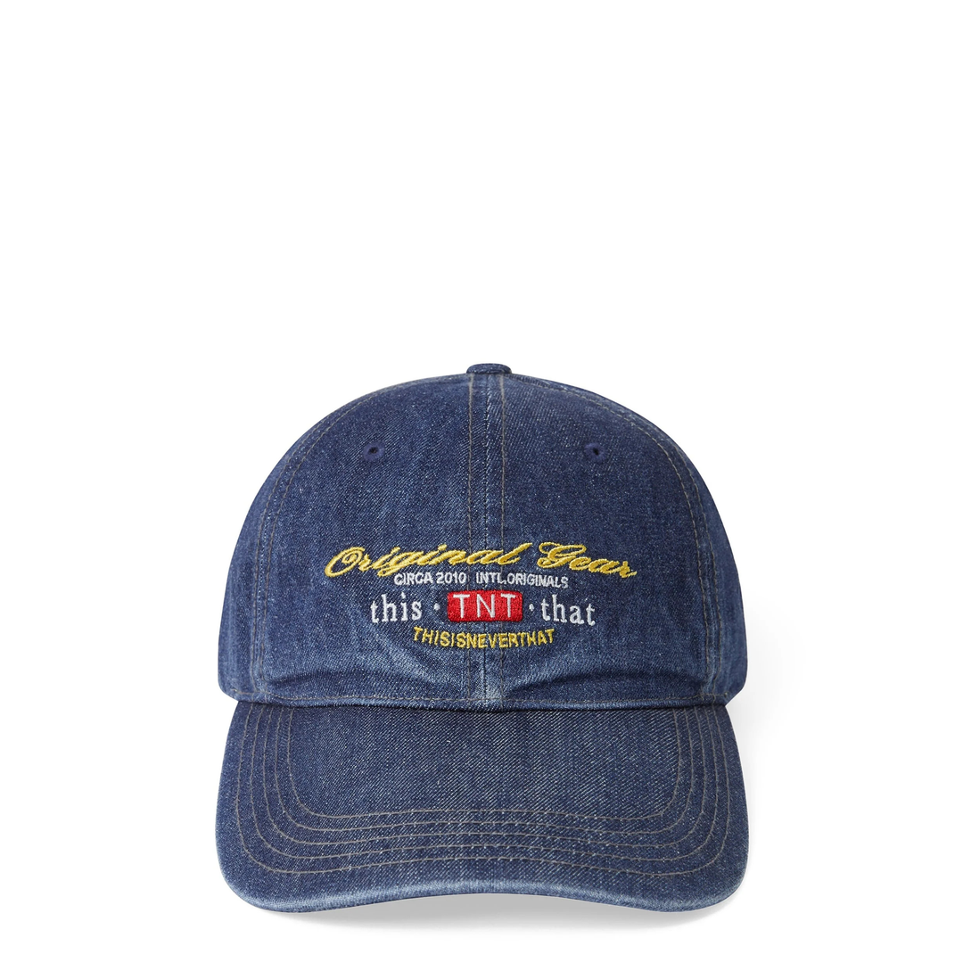 thisisneverthat Original Gear Denim Cap in washed indigo, featuring embroidered gold script, TNT badge, and six-panel construction, front view