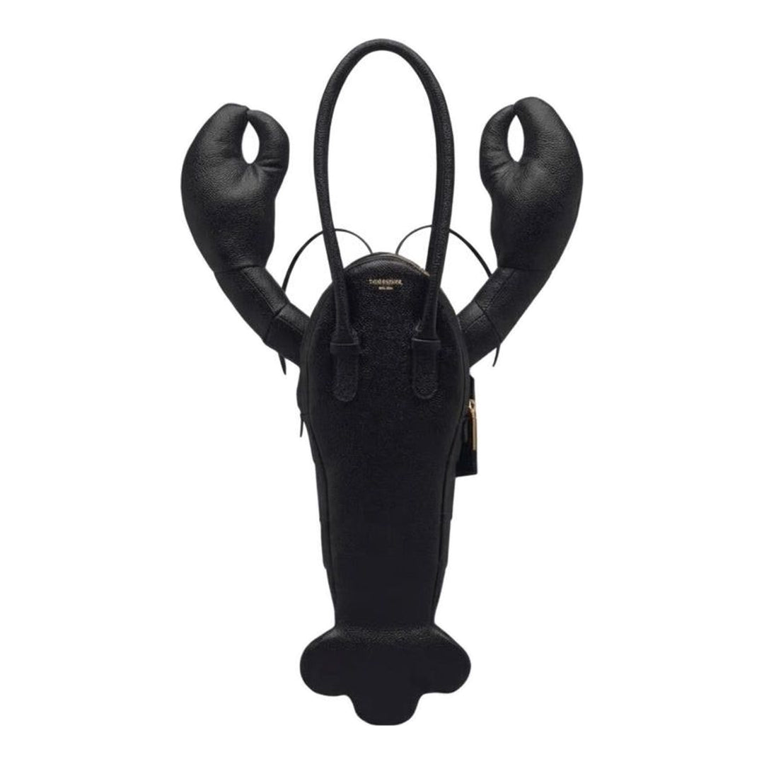 Thom Browne black pebble-grain leather lobster-shaped tote bag with raised claws, rolled handles and a luggage tag - packshot
