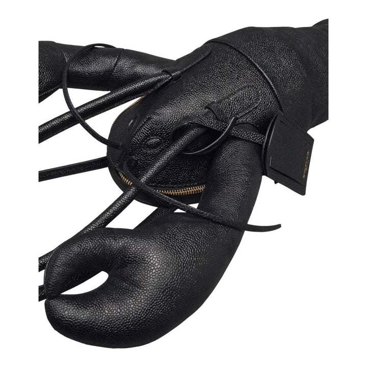 Thom Browne black pebble-grain leather lobster-shaped tote bag with raised claws, rolled handles and a luggage tag - packshot