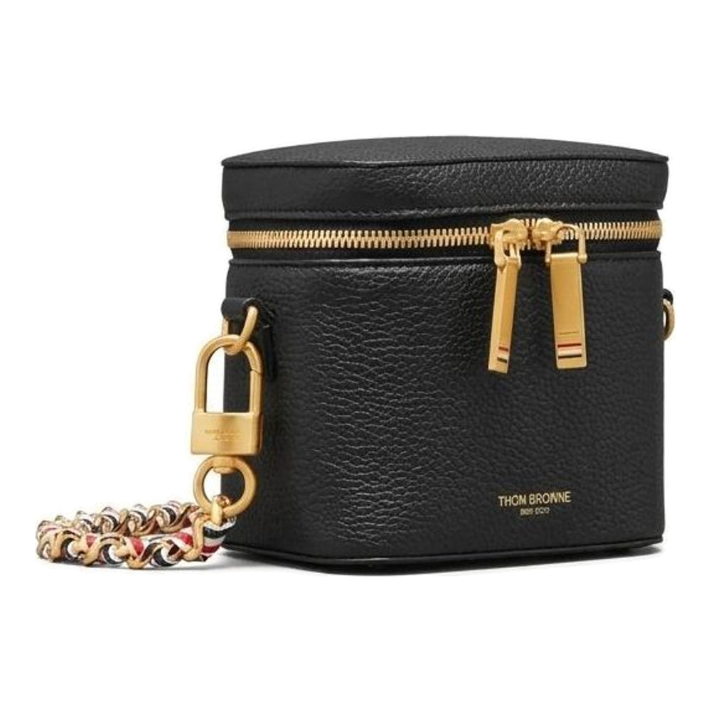 Thom Browne burgundy pebbled leather box pouch with double gold-tone zip closure and long crossbody chain strap featuring red, white, and blue woven ribbon interlaced with gold links - packshot