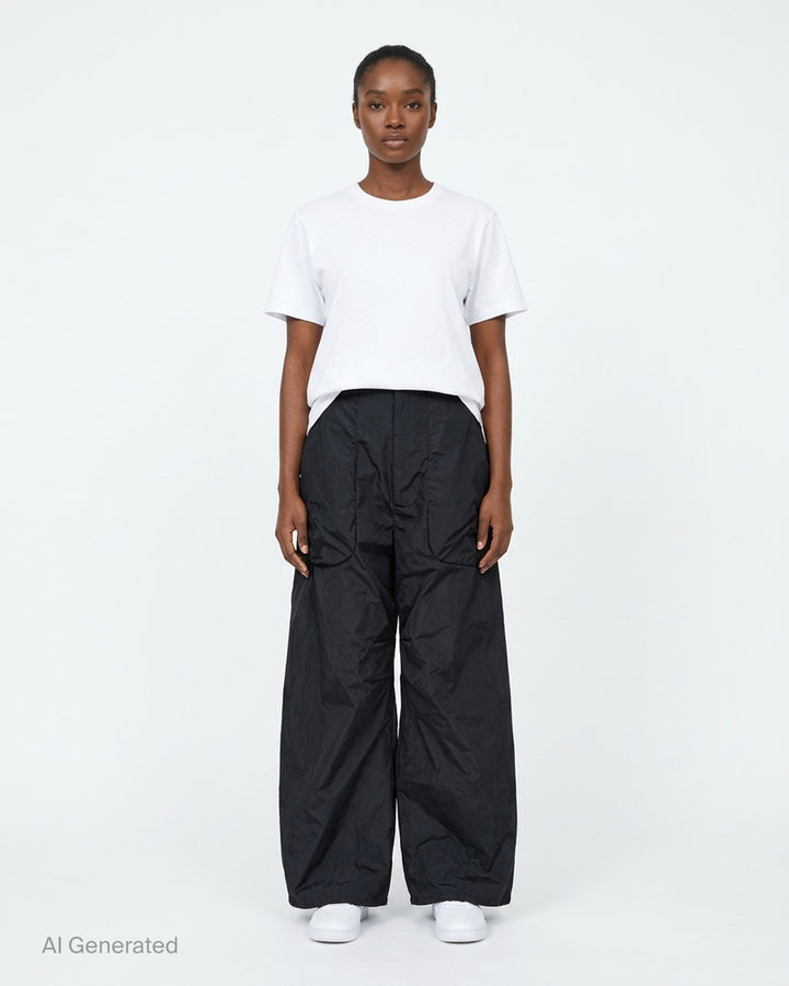 Black high-waisted wide-leg cargo tailored trousers with ruched sculpted pockets and a crinkled finish, shown from the front - front