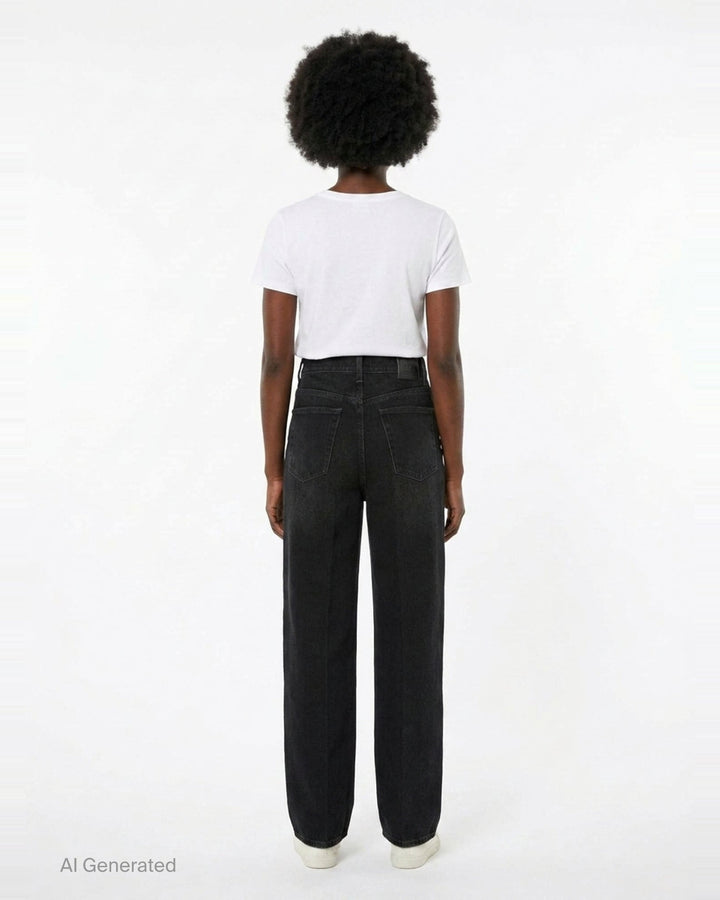 Totême Wide Leg Jeans in washed black denim, featuring a high-rise waist, five-pocket construction, and a relaxed straight-falling leg, shown flat against a white background - back