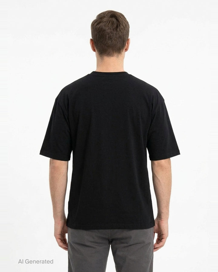 Undercover Bear Print Tee in black, featuring an oversized collage-style multicolour teddy bear graphic on the chest, laid flat on a white background - back