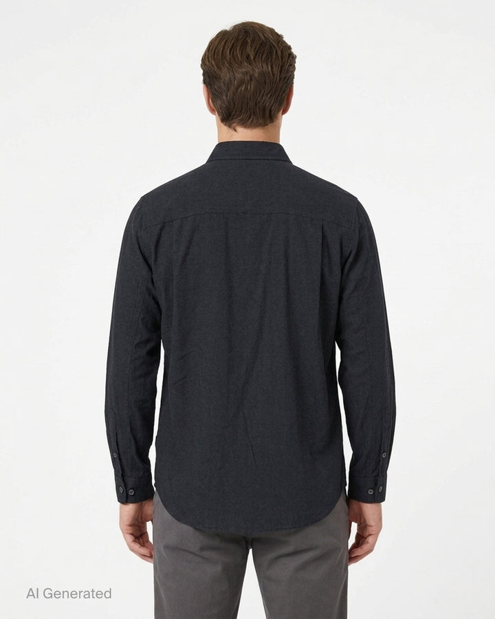 Undercover two pocket long sleeve shirt in washed black with raw-edged chest pockets and pearlescent buttons, front view - back