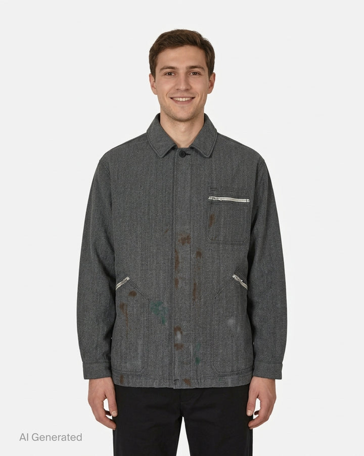 visvim Eclair Coverall Custom Long jacket in washed charcoal grey with paint splatter details, zip chest pocket and angled zip waist pockets - front