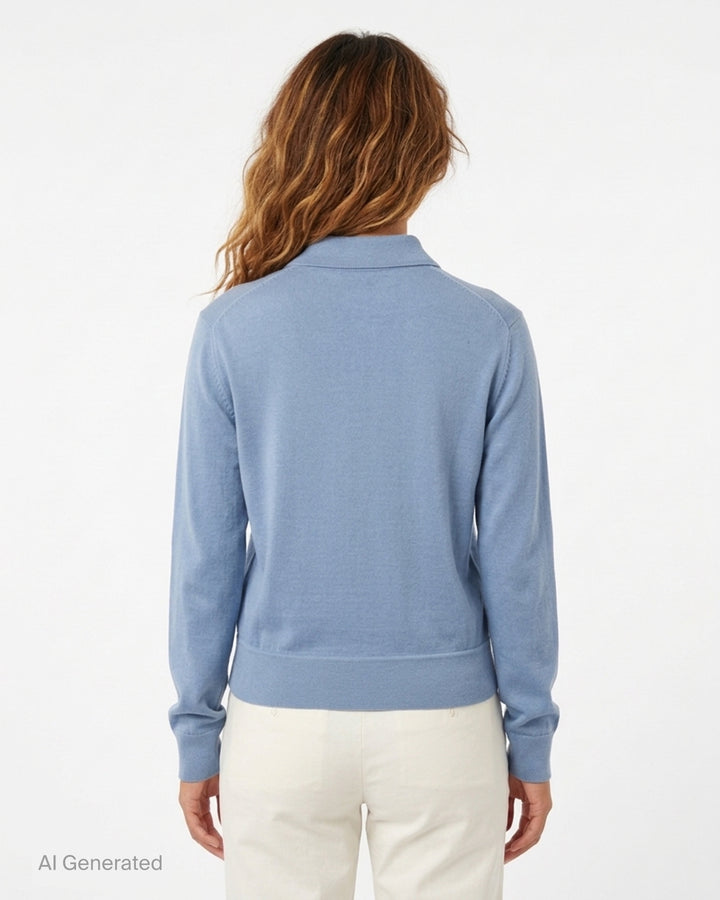 Zimmermann Valiant long sleeve polo with a silk front panel printed with a vintage world map and aeroplanes, framed by blue knit collar, sleeves, and hem - back
